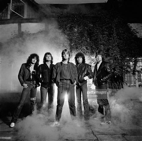 Ozzy Osbourne and his band pose together in front of Ridge Farm ...