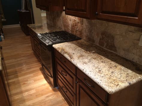 Sienna Beige Granite Countertop With Stunning Rock Backsplash