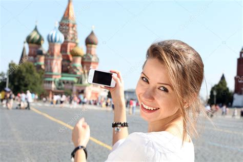 Woman photographed attractions in Moscow – Stock Editorial Photo © arkusha #12148093