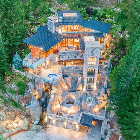 Iconic Waterfall House Built Into A Stone Cliff In Whistler Waterfall