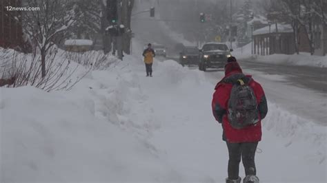 Flagstaff woman walks through record-breaking snowfall for her man ...