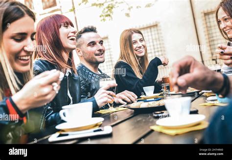 Friends Drinking Cappuccino At Coffee Restaurant Millenial People