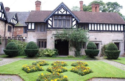 Architecture, yew topiary, and flower beds — Stock Photo © rose4 #66288339