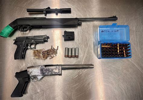 Cochrane RCMP seize prohibited weapons, suspects in custody
