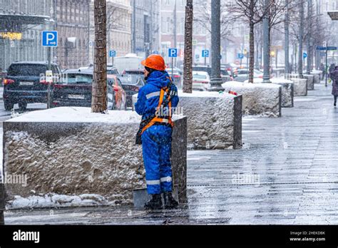 Russia Moscow A Utility Worker Clears Snow Stock Photo Alamy