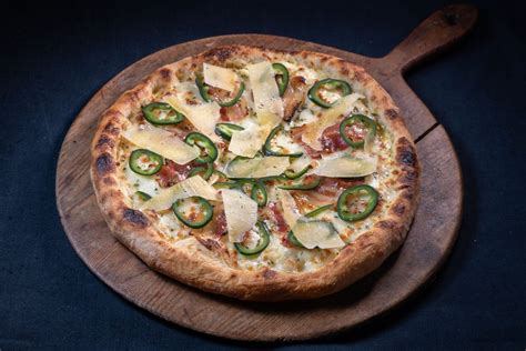 Pizza Bianco With Honey Cured Bacon Rosemary And Jalapeño Peppers Sy Selkie