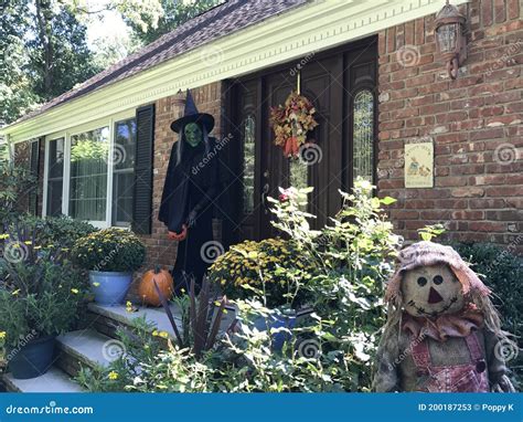 The Scary Green Face Witch With Black Outfit And Pointed Hat In Front