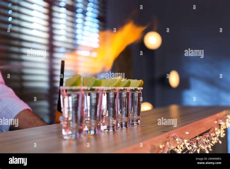 Mexican Tequila Shots With Lime Slices On Bar Counter Stock Photo Alamy