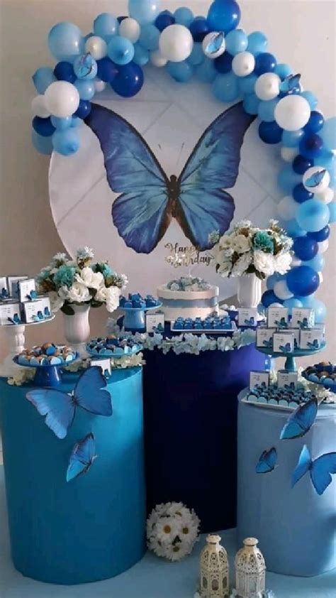 A Blue And White Dessert Table With Balloons