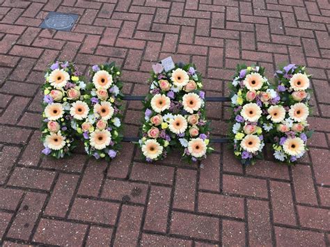 Loose Filled Pastel Nan Funeral Flower Tribute Including Peach Lilac