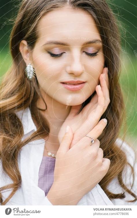 Beautiful Female Face With Perfect Skin And Nude Makeup Close Up