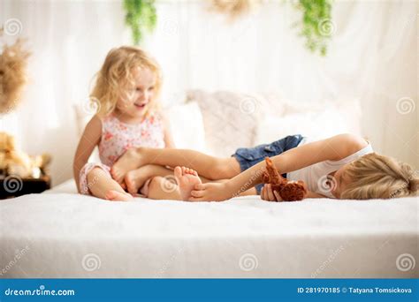 Cute Sweet Toddler Children, Tickling Feet on the Bed, Laughing and ...