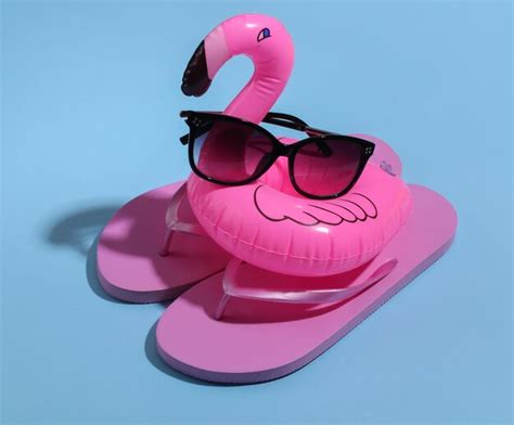 Premium Photo Inflatable Pink Flamingo With Sunglasses Flip Flops On