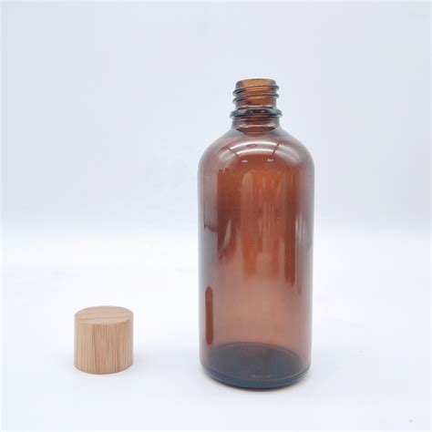 Custom Cosmetic Packaging 100ml Amber Glass Bottle With Bamboo Wooden