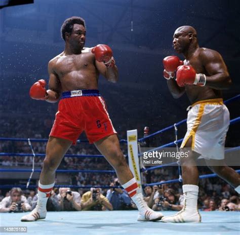 George Foreman In Action Vs Joe Frazier During Fight At Nassau