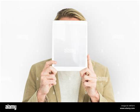 Man Holding Up Tablet Covering Face Stock Photo Alamy