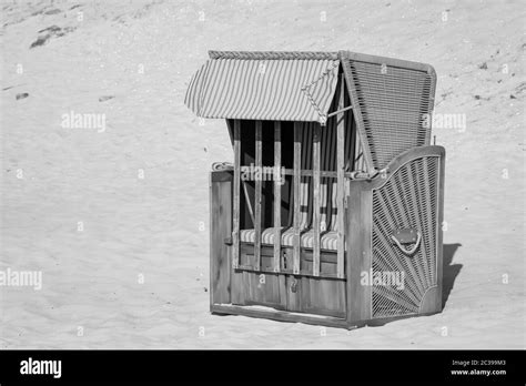 A Beach Chair That Is Locked Stands On The Beach Of The Baltic Sea