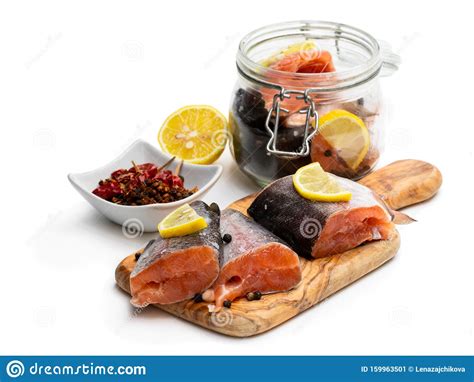 Salted Rainbow Trout Slices With Lemon Slices On Wooden Board Isolated