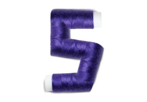 premium photo number   thread spools isolated  white