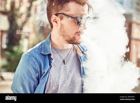 Teenage boy smoking Stock Photo - Alamy