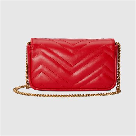 GG Marmont matelassé super mini bag in red leather GUCCI SE