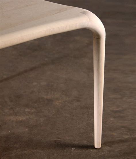 A White Table Sitting On Top Of A Cement Floor