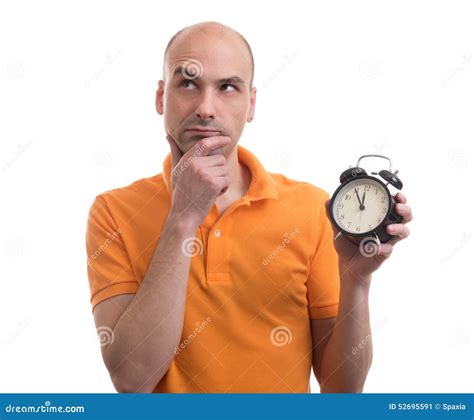 Bald Man Holding An Alarm Clock And Thinking Stock Image Image Of