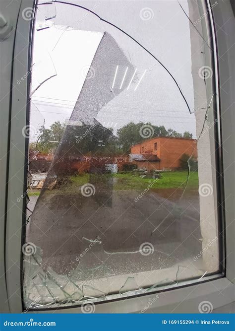 The Storm Left A Broken Window With Shards Of Glass Stock Photo - Image
