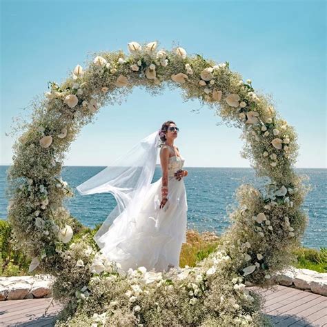 nusrat jahan  mesmerising   white gown   walks  aisle