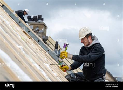 Roofing Team Working At Height Stock Photo Alamy