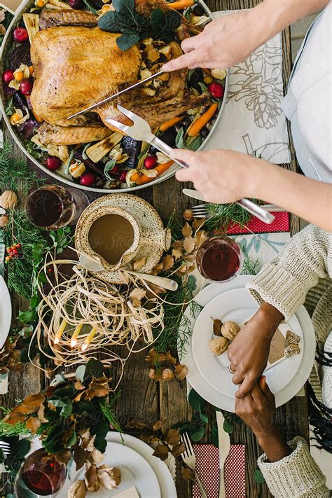 Carving The Thanksgiving Turkey By Stocksy Contributor Cwp Llc