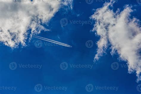 Four Engined Airplane During Flight In High Altitude With Condensation