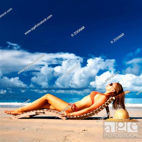 Woman In Bikini Lying On Beach At Seychelles Stock Photo Picture And