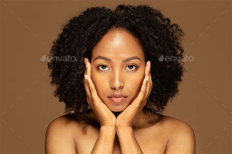 Closeup Of Beautiful Half Naked Black Woman Touching Her Face Stock