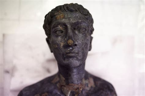 Italy's ancient bronze statues rescued by garbage man, on display ...