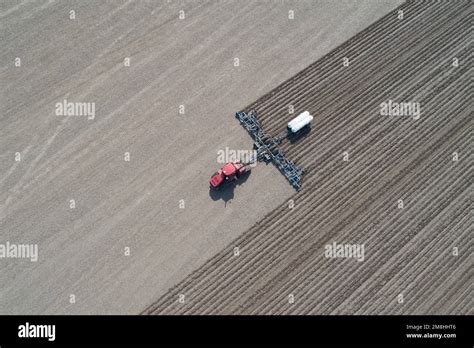 63801 16107 Aerial View Of Tractor Applying Anhydrous Ammonia To Corn