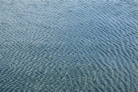 Abstract Background Of River Water Flow Under The Influence Of Light