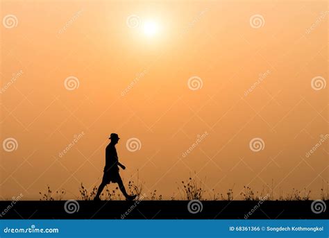 Silhouette Man Walking On The Sunset Background Stock Photo Image Of