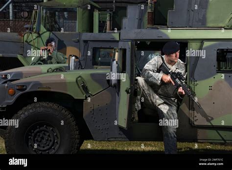 Military police officers secure tactical vehicles on base Stock Photo - Alamy