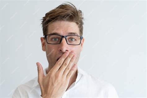 Free Photo Surprised Handsome Man Covering Mouth With Hand