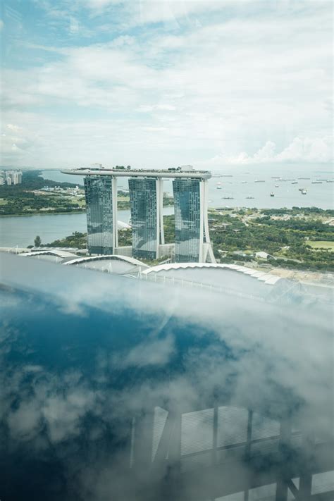 White Concrete Building Near Body Of Water During Daytime Photo Free Nature Image On Unsplash