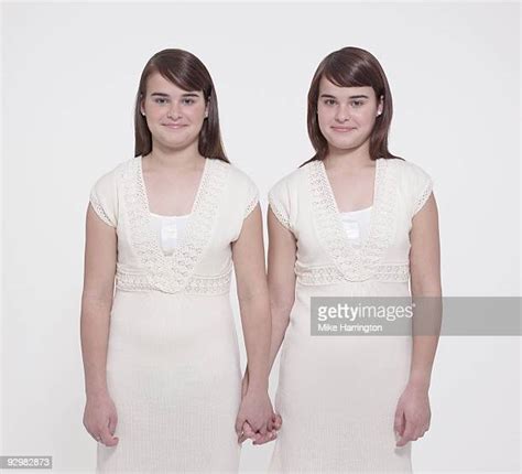 Twin Girls Holding Hands Photos And Premium High Res Pictures Getty