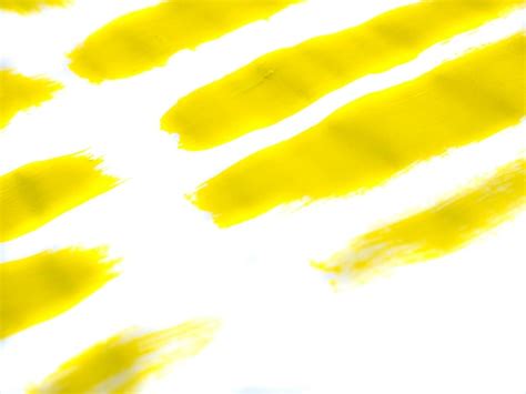 Premium Photo | Yellow acrylic paint stroke isolated on white background abstract art concept