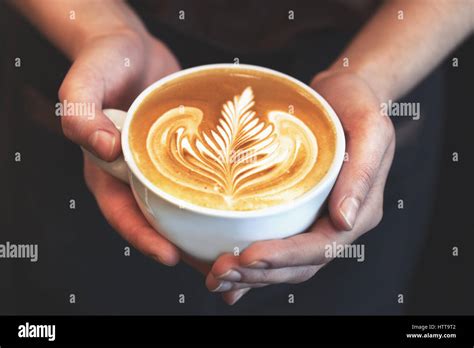 Cup Of Coffee Latte Art Made By Barista Focus In Milk And Coffee