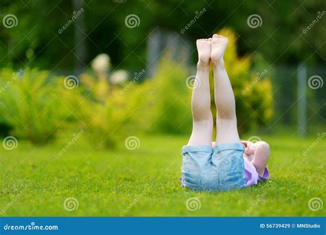 Cute Little Girl Laying In The Grass Stock Image Image Of Girl