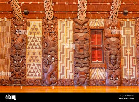 Traditional Maori Carvings In The Interior Of Te Whare Runanga The