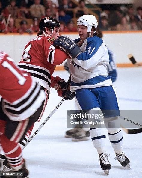 Bruce Boudreau of the Toronto Maple Leafs skates against Keith Brown ...