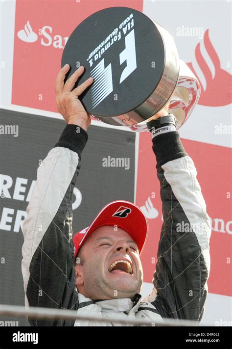 Brazilian Rubens Barrichello Of Brawn Gp Celebrates On The Podium After