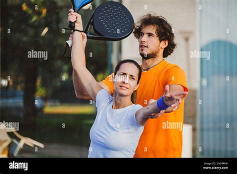 Young Teacher Is Monitoring Teaching Padel Lesson To His Student