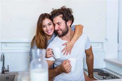 Romantic Couple In Love Spending Time Together In Kitchen Cute Young Couple Drinking Coffee In